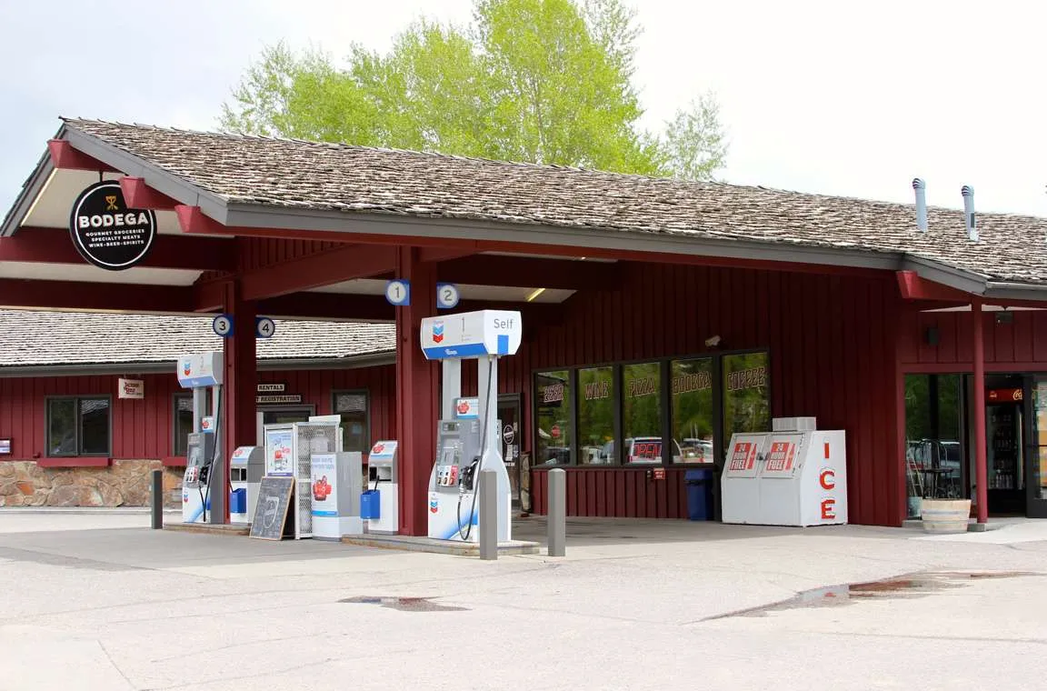 Bodega grocery store and bottle shop in Jackson Hole, featuring wine, craft beer, and grab-and-go provisions, with a rustic red exterior and a sloped roof.